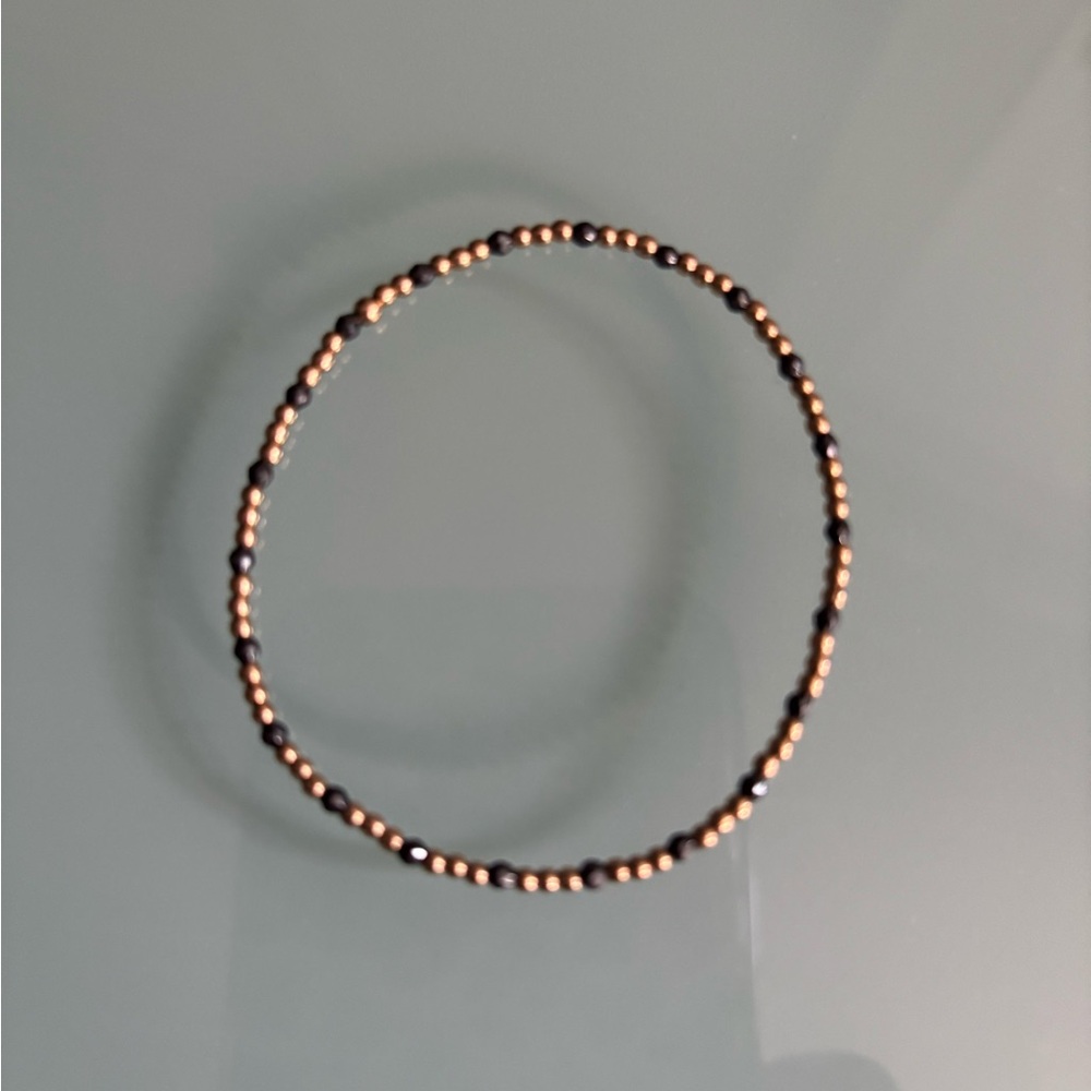 Like new enewton dark gray gold bracelet